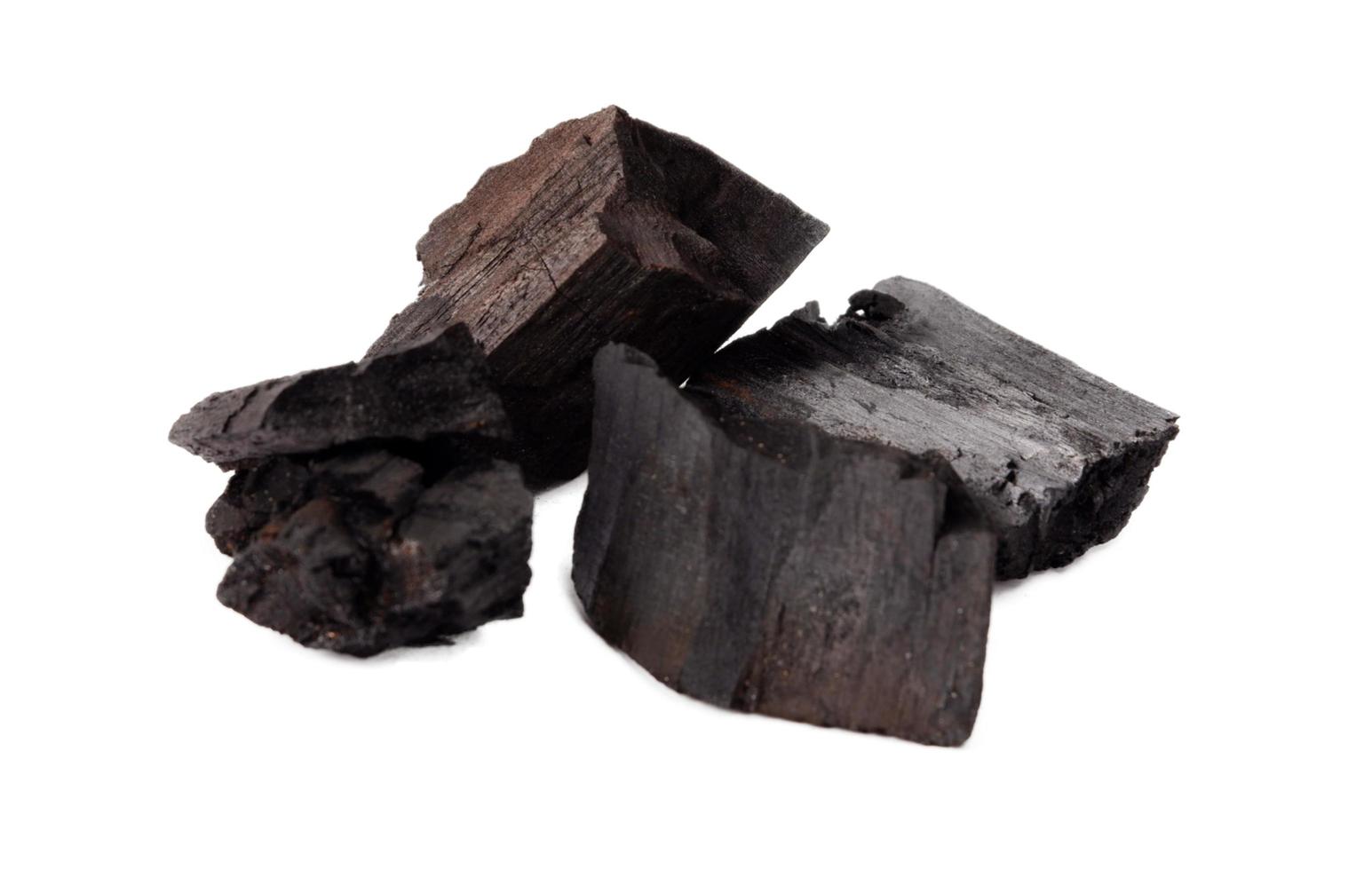 Wood charcoal isolated on a white background photo