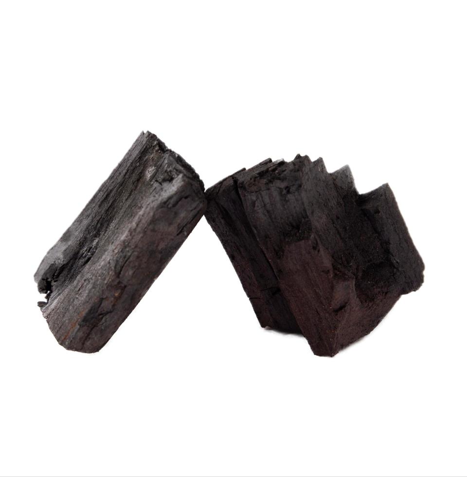 Wood charcoal isolated on a white background photo