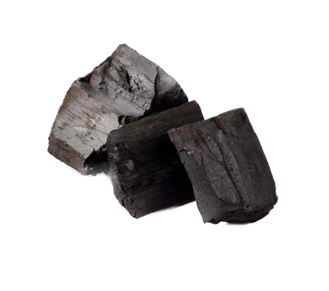 Wood charcoal isolated on a white background photo