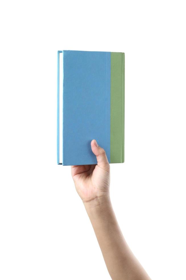 Hand holding pastel book on white background photo