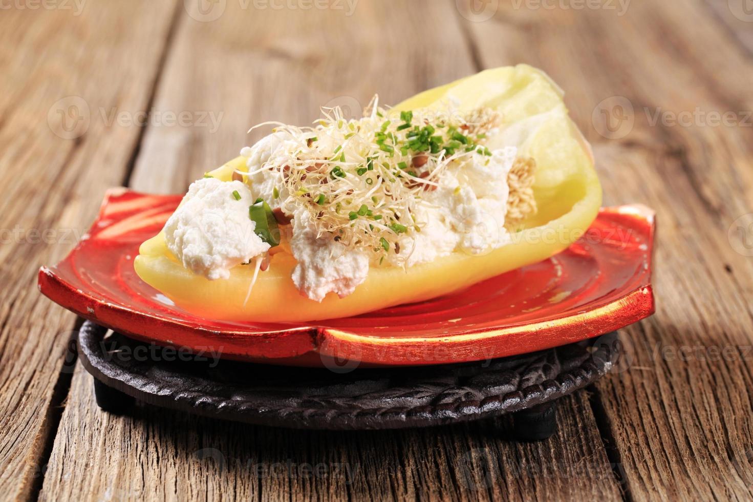 Healthy appetizer - Pepper with curd cheese and lentil sprouts photo