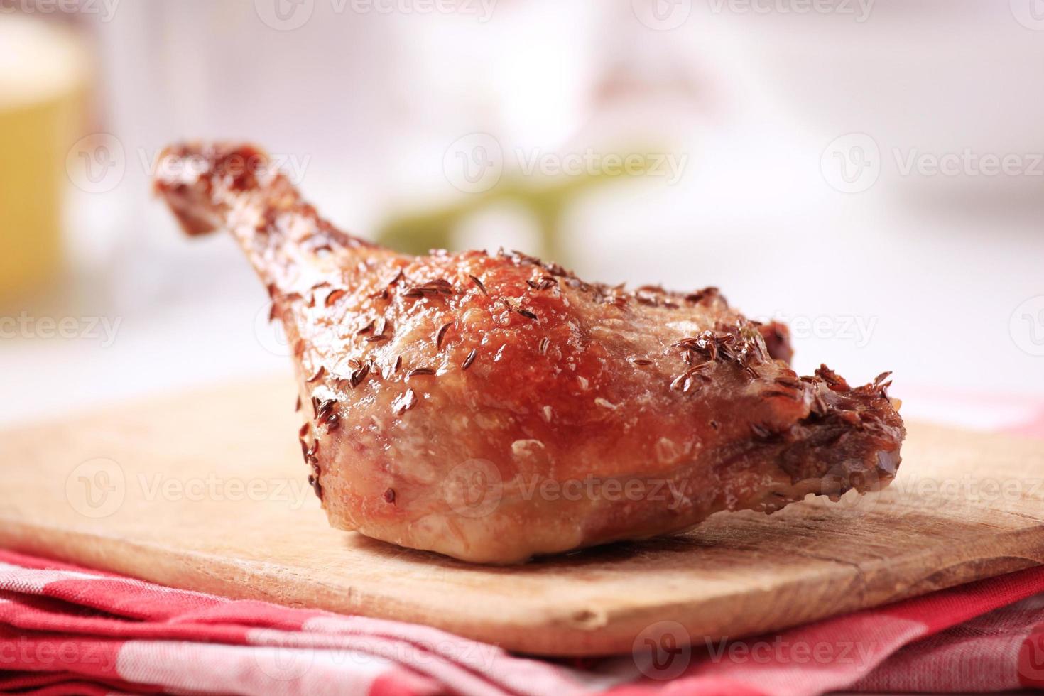 Roast leg of duck sprinkled with caraway seeds photo