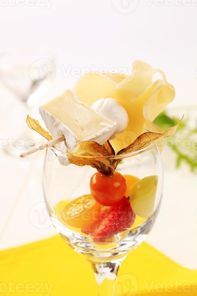 Cheese and fruit appetizer photo