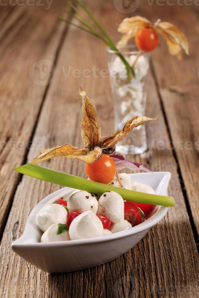 bocconcini con tomates foto