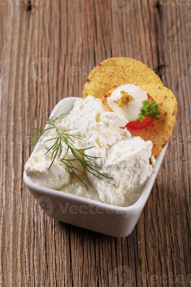 Fresh cheese and corn chips photo