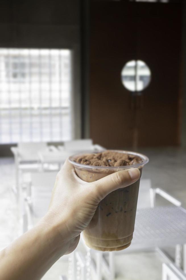 Hand on iced chocolate cocoa photo