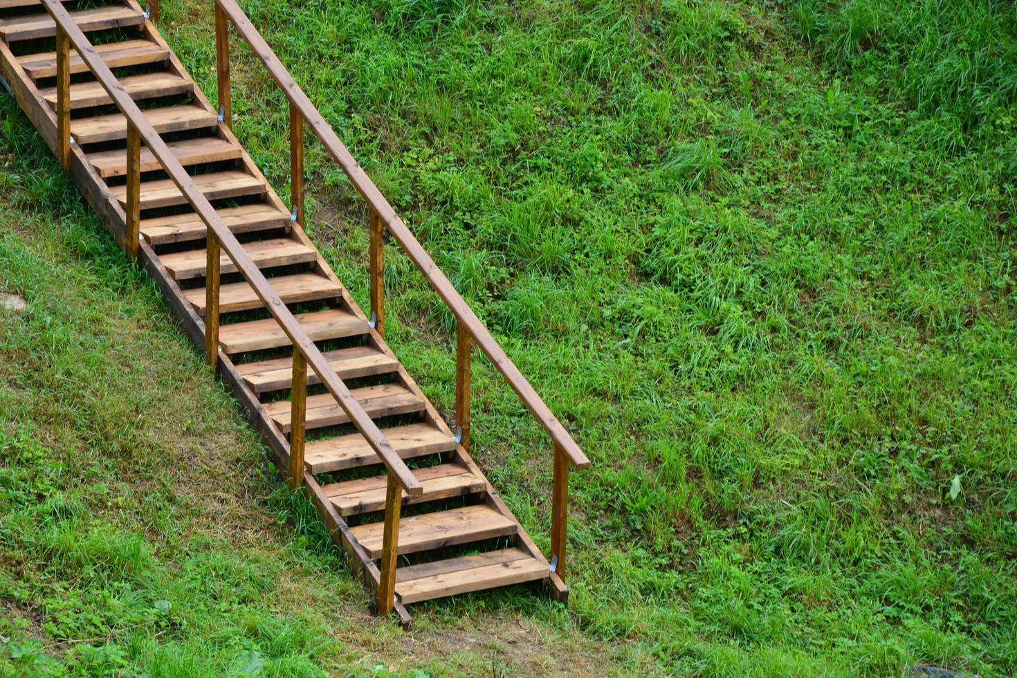 Wooden ladder for climbing the mountain. Climbing the stairs to photo