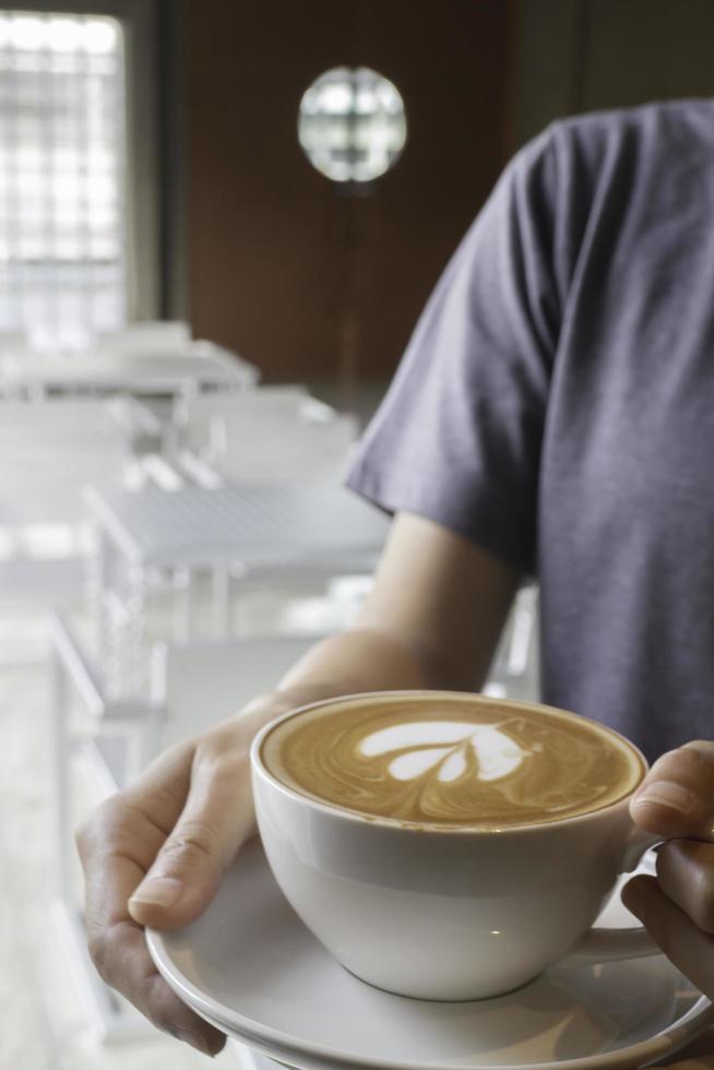 Latte art on hot milk coffee photo