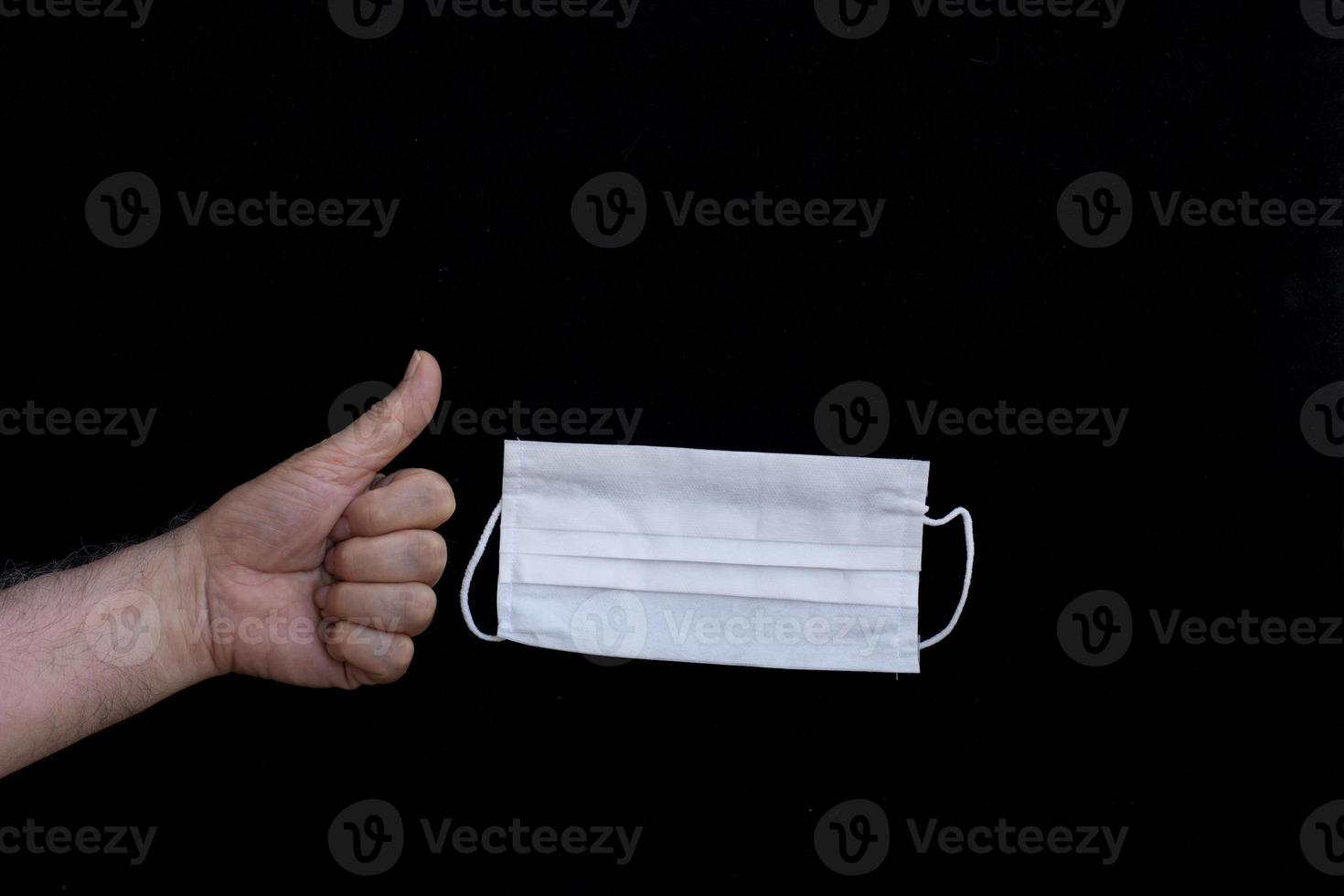 health mask in front of black background photo