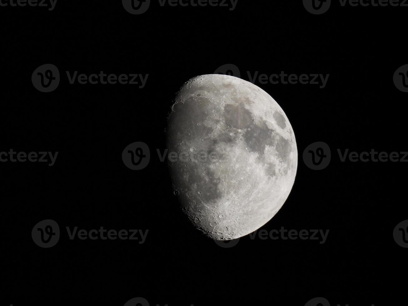 Gibbous moon seen with telescope photo