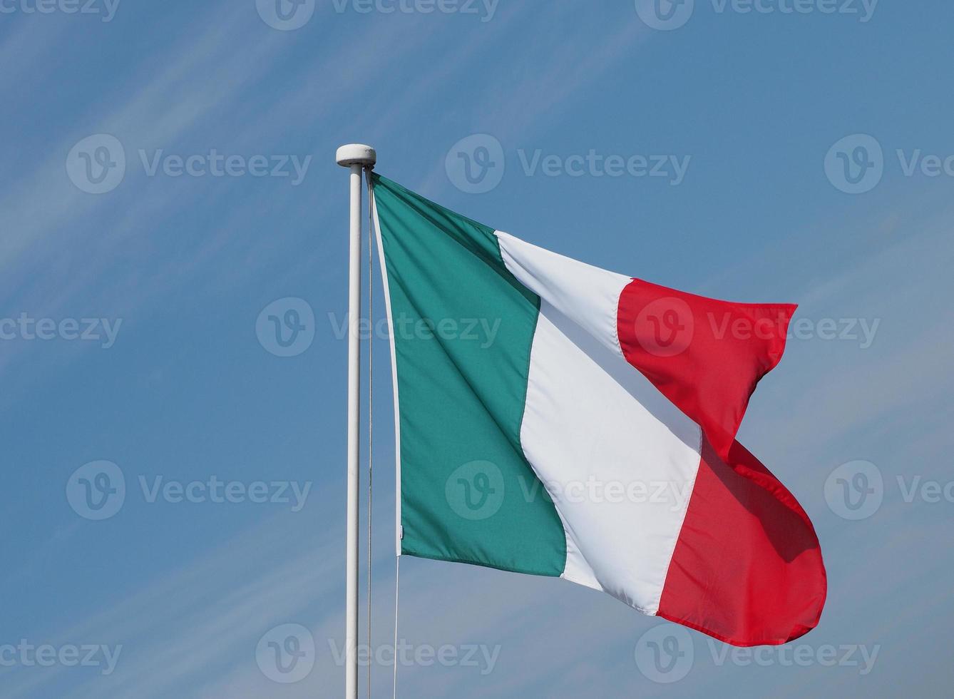 Italian Flag of Italy over blue sky photo