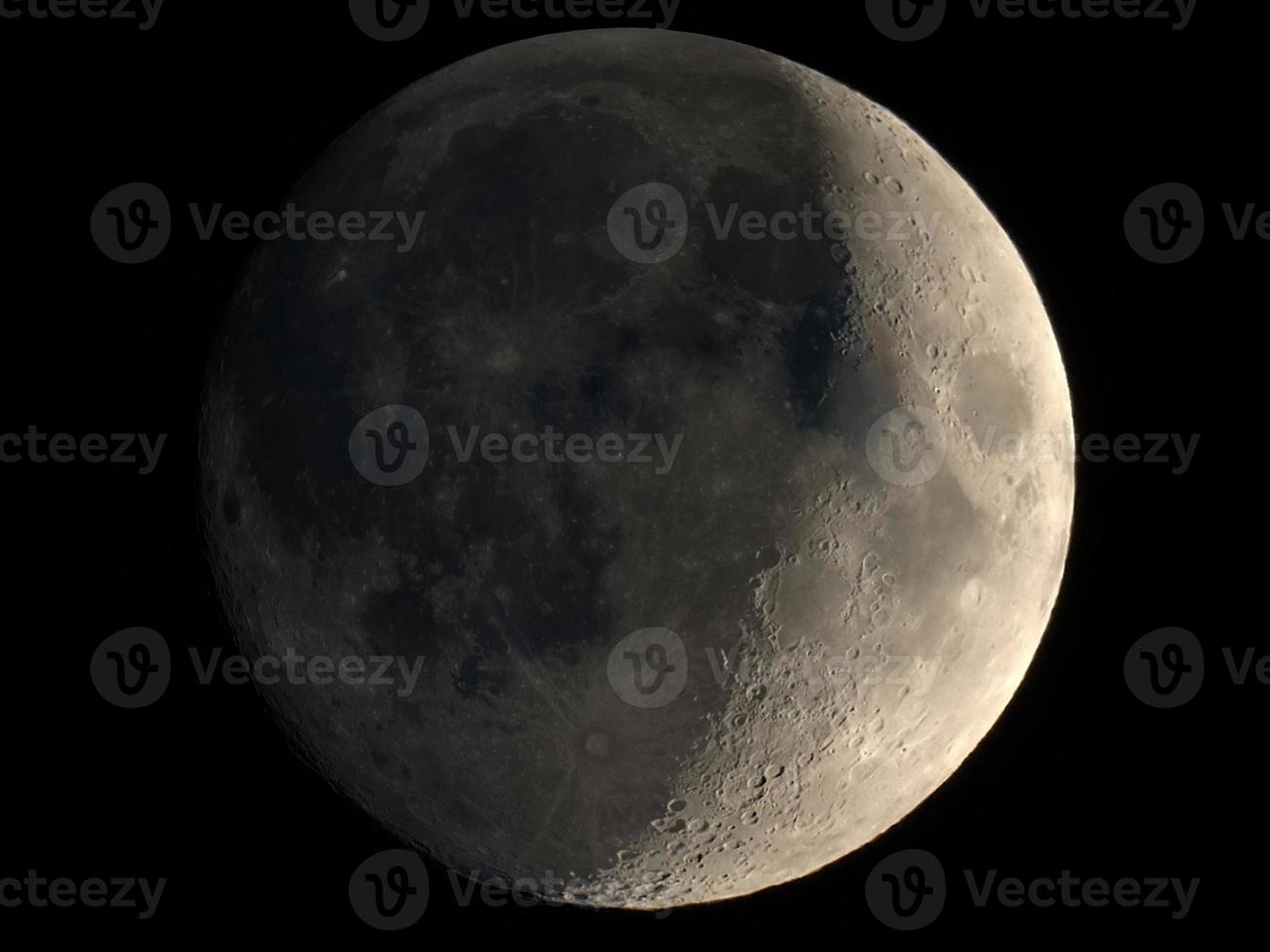 Waxing crescent moon seen with telescope photo