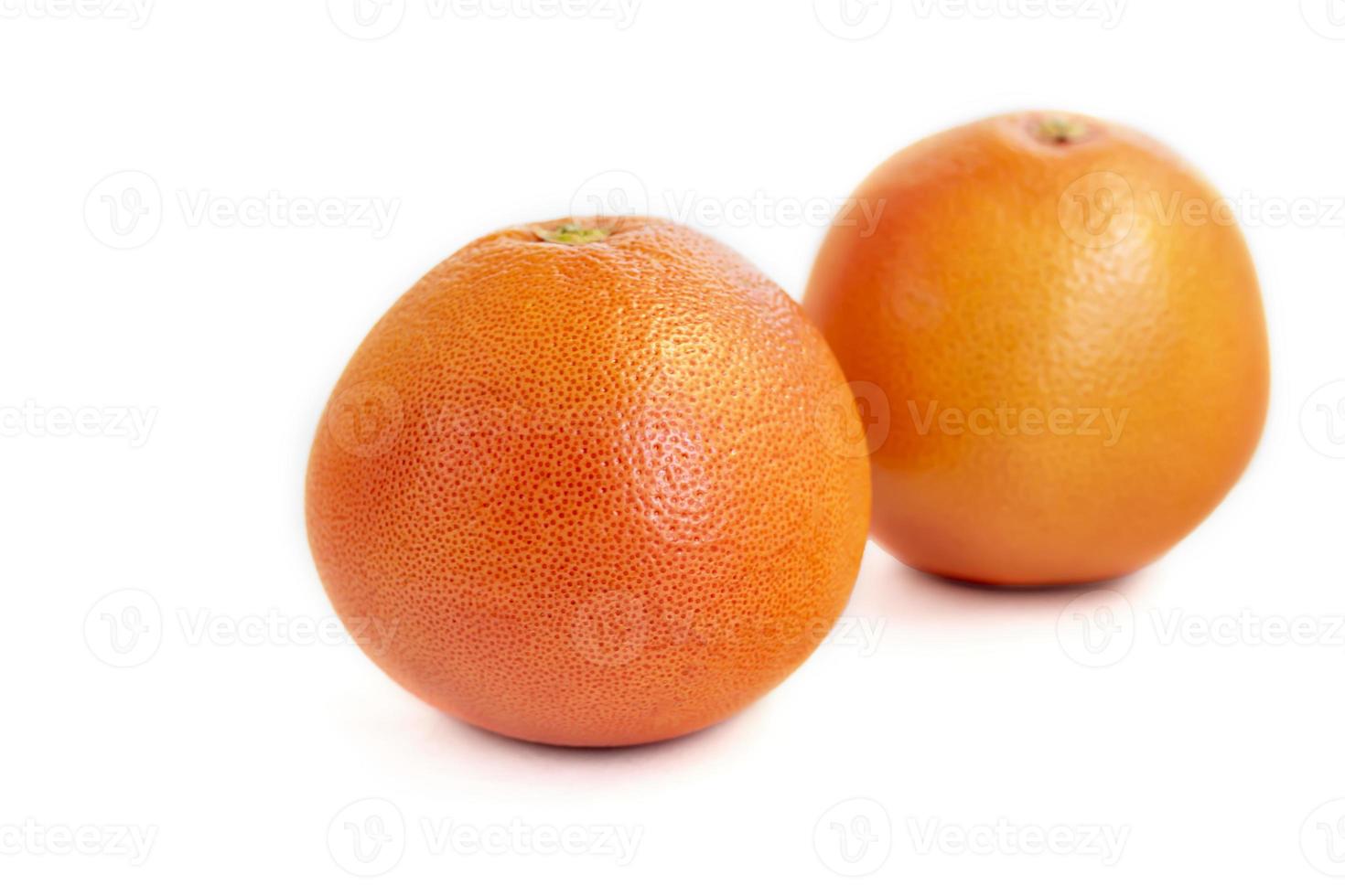 Grapefruit on a white plate with a sprig of mint. Isolate. photo