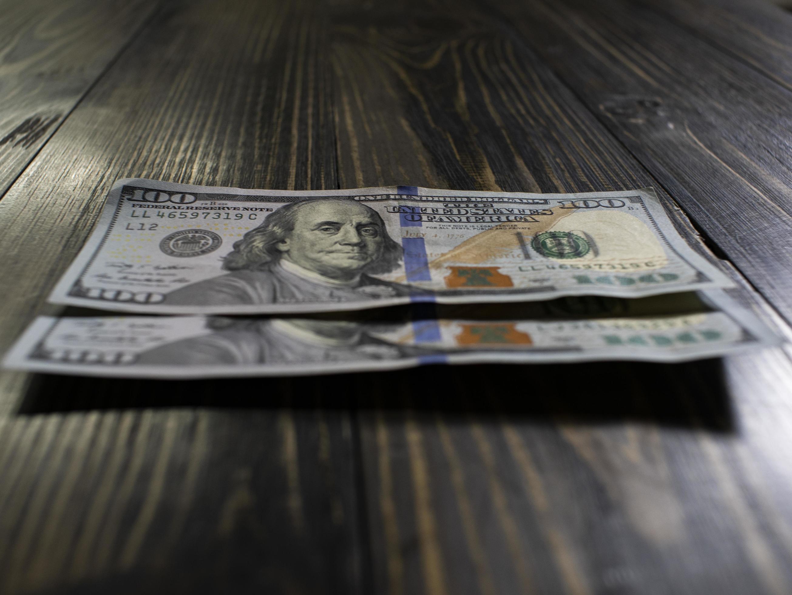 Two Hundred Dollars Bills On A Wooden Background 3167274 Stock Photo At 