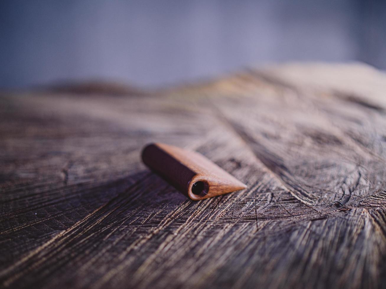 handmade beard comb on a wood stump photo