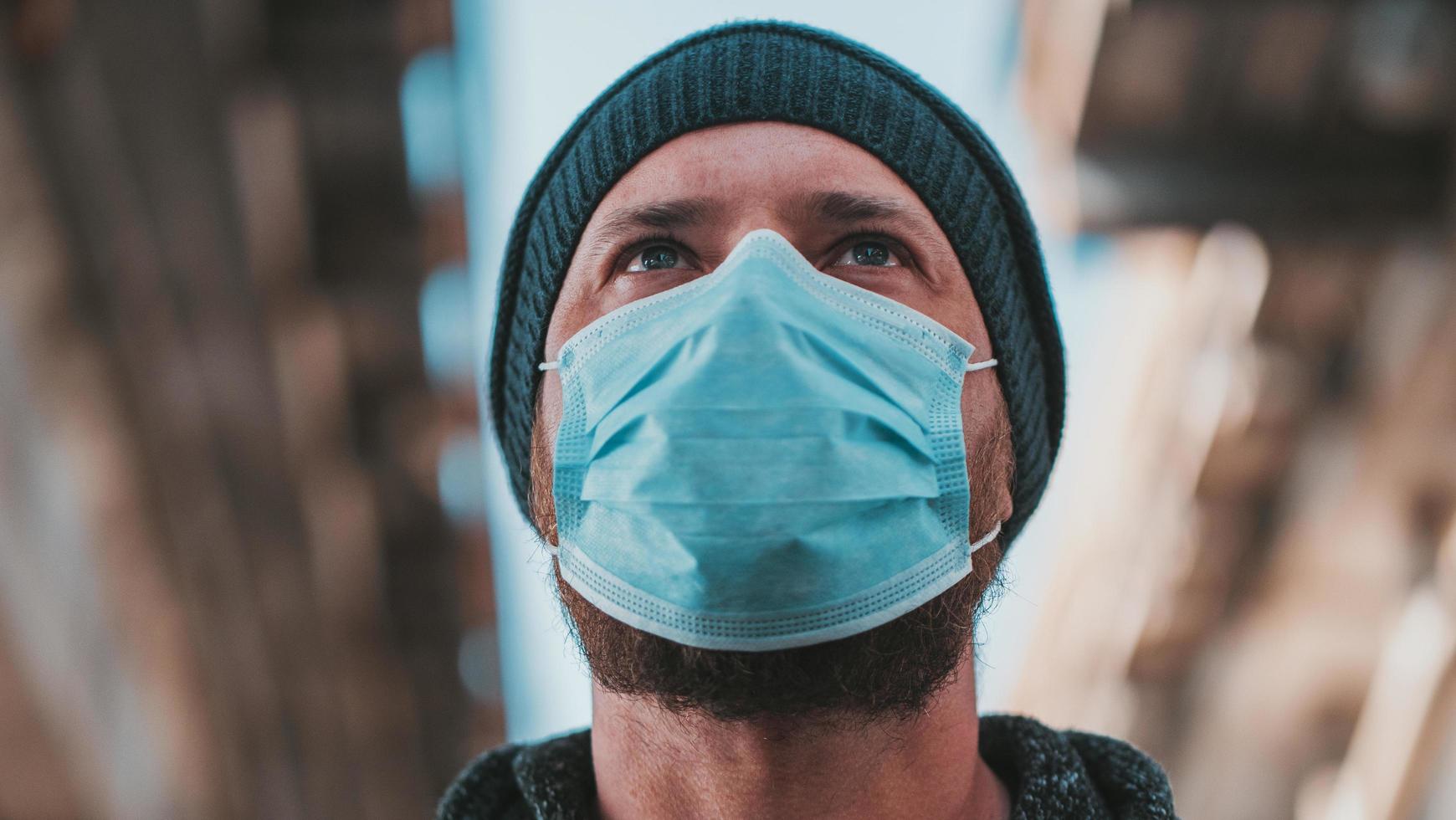 Close Up Portrait Of A Hipster Man In A Medical Mask photo