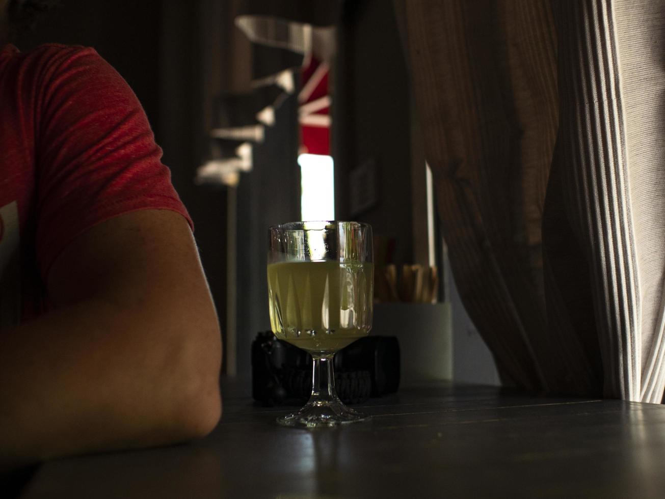 a glass with lemonade on a table in a cafe photo