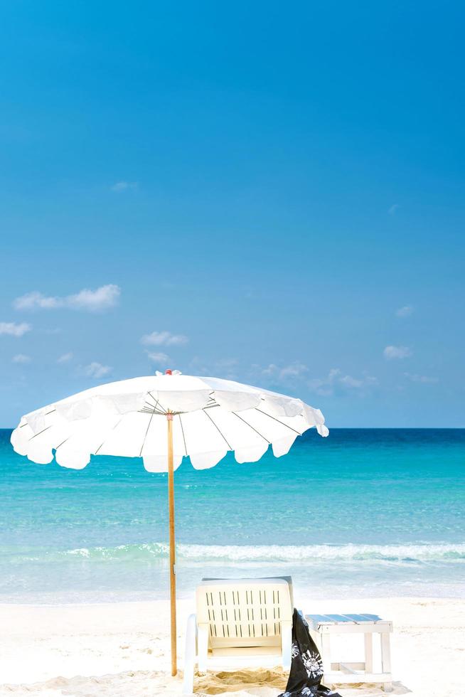 Summer vacation deckchairs and umbrella photo