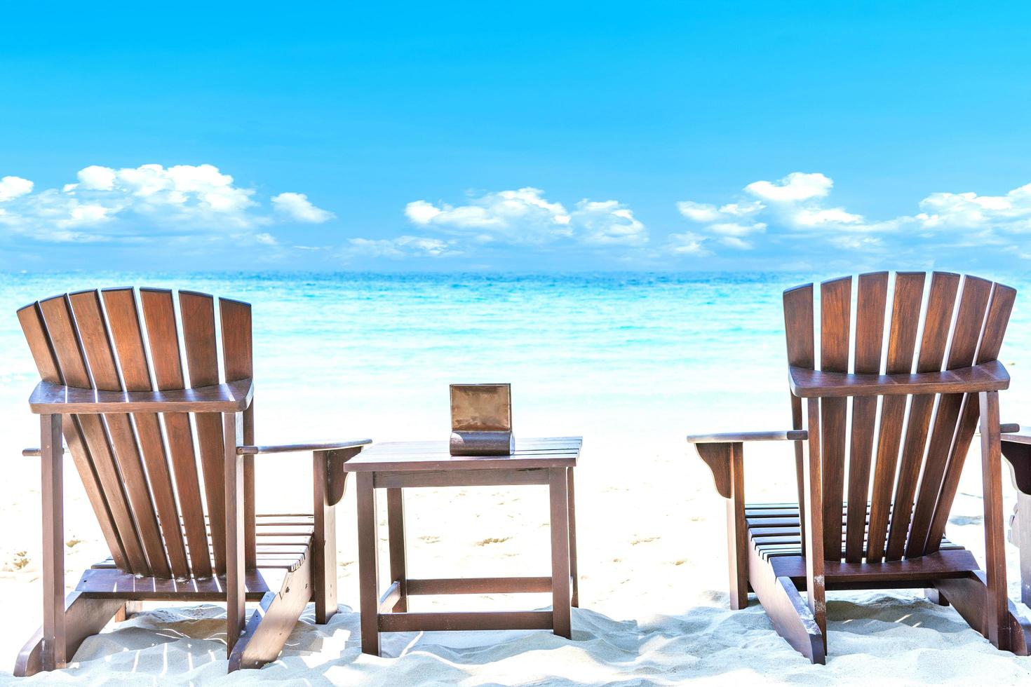 Summer vacation background with deckchairs photo