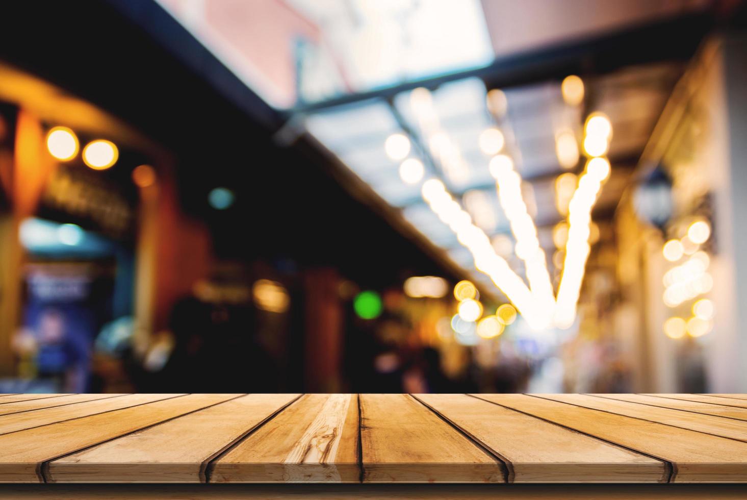 Empty wooden table space and front of abstract blurred background photo