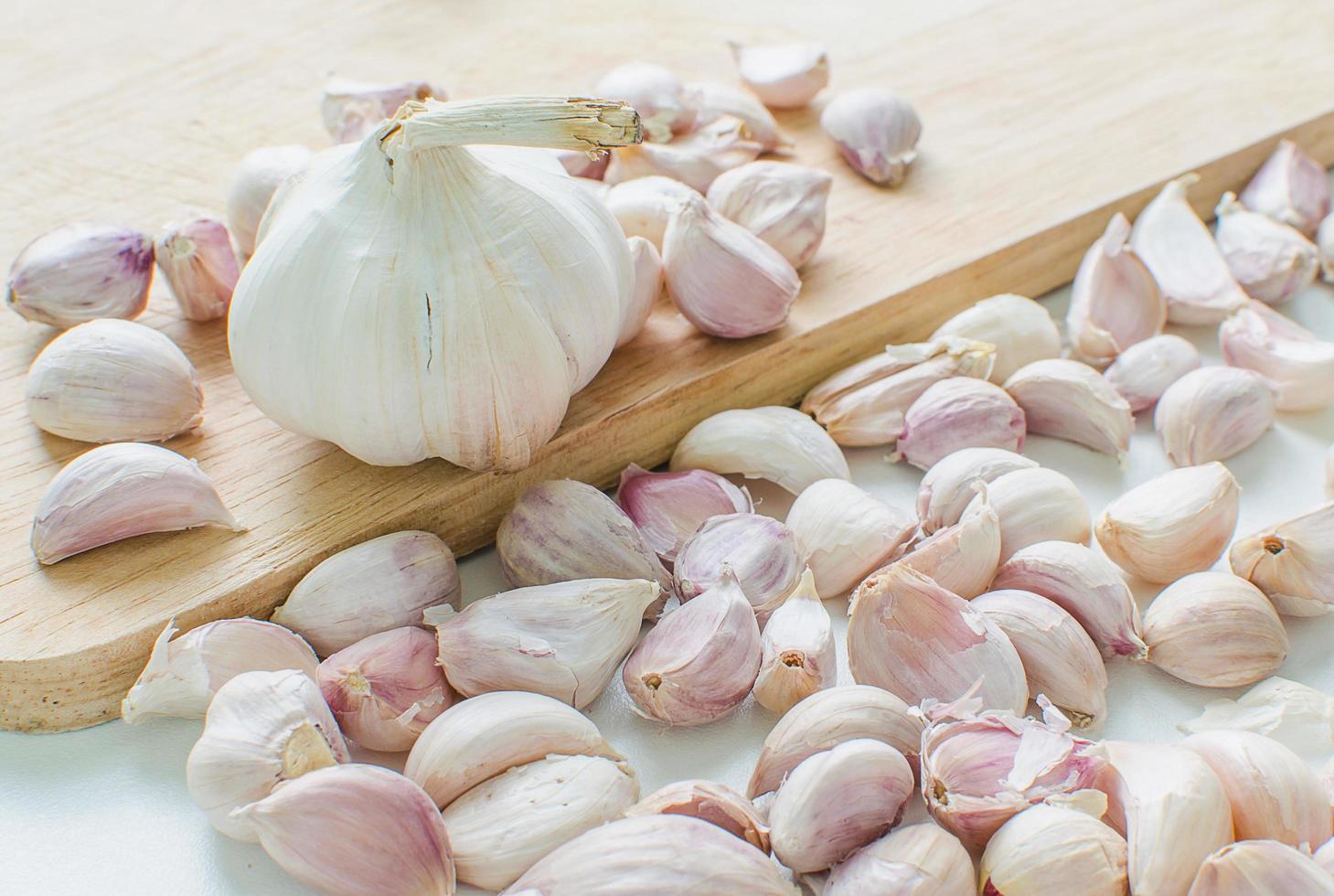 sliced garlic on wooden background photo