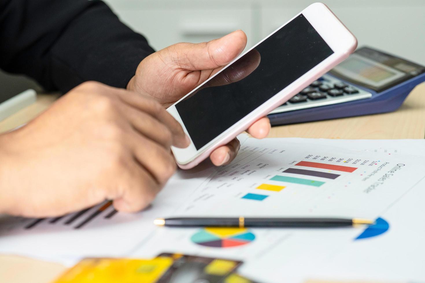 Asian accountant working with mobile phone in office photo