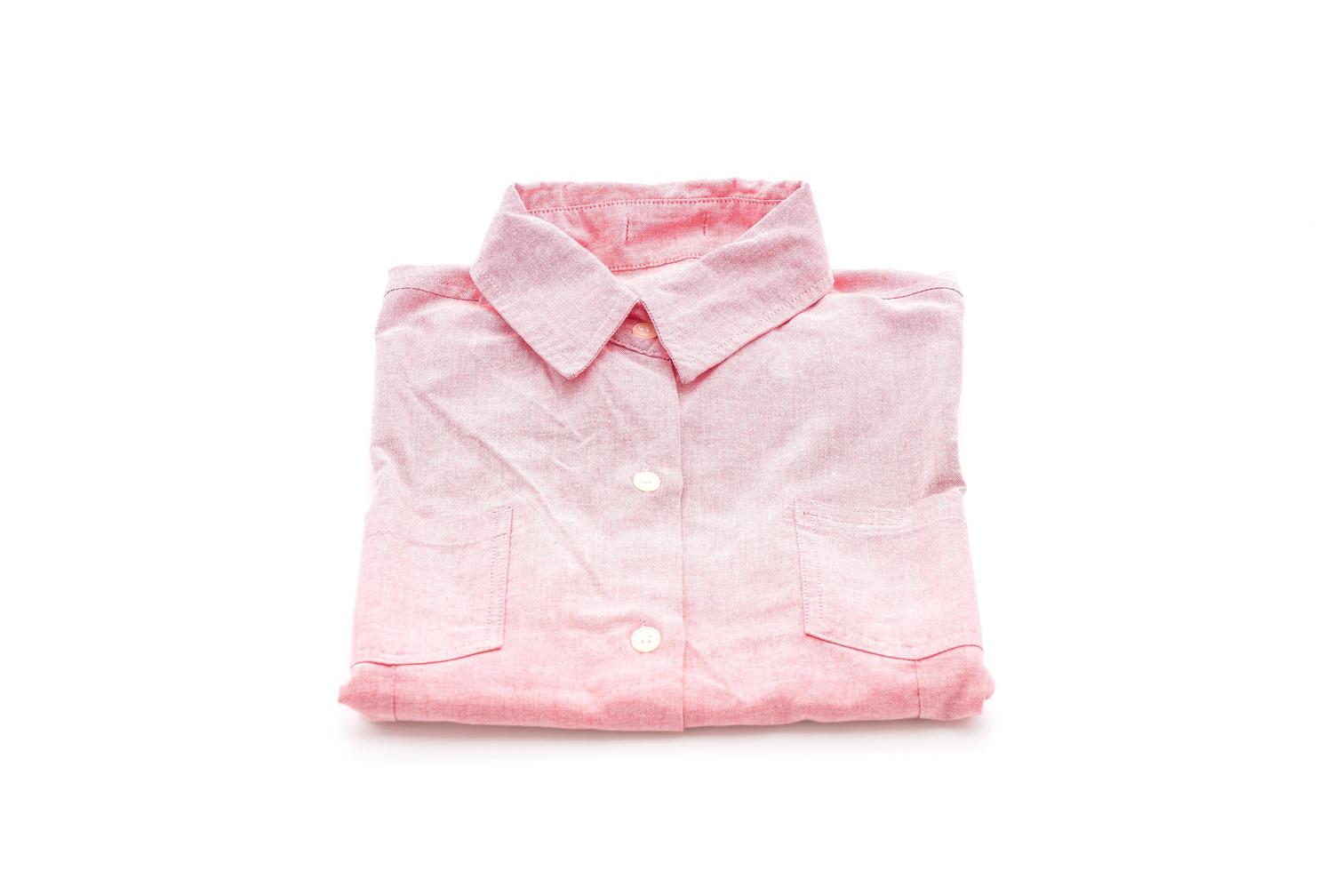 Pink shirt folded on white background photo