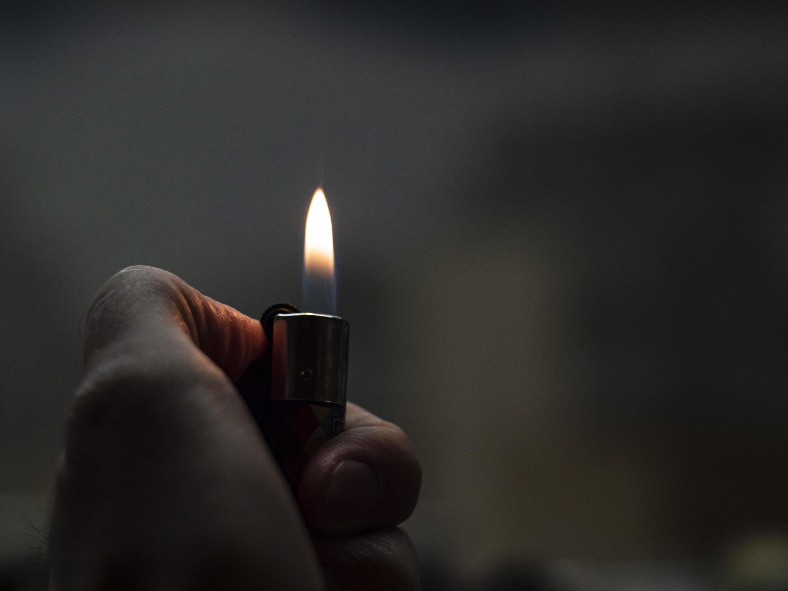 Men's hands hold lighters, fire from cigarette. 3172898 Stock Photo at