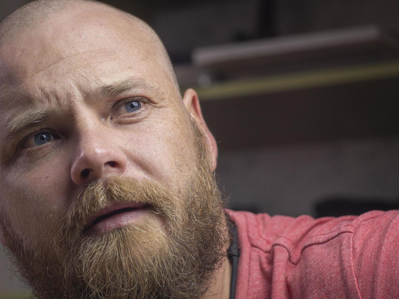 Portrait of a bald man with a beard photo
