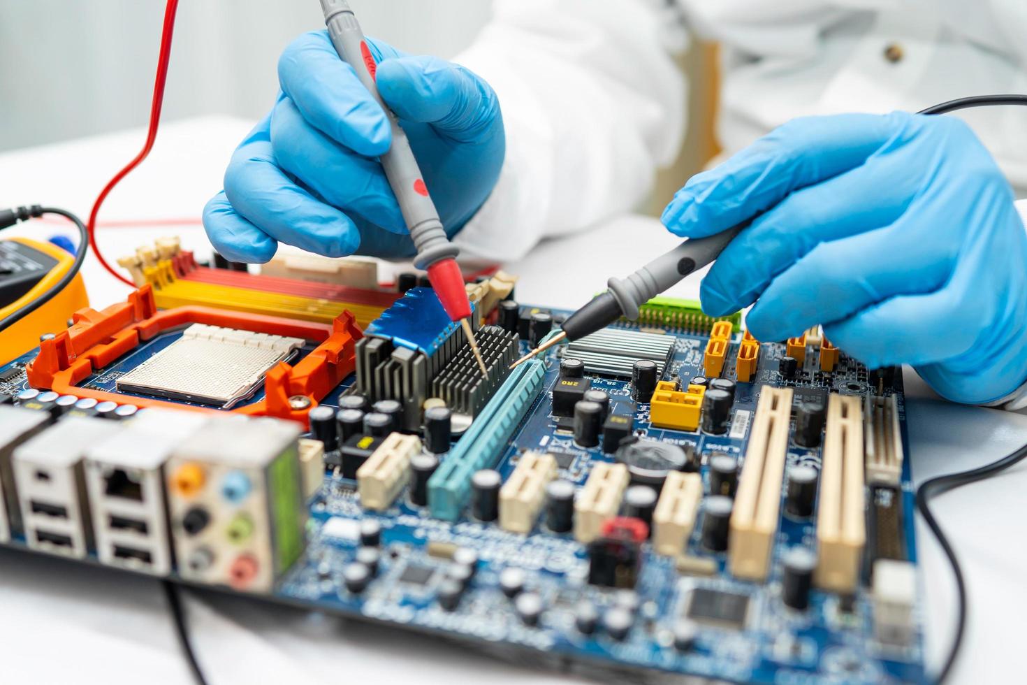 technician repairing inside of hard disk photo