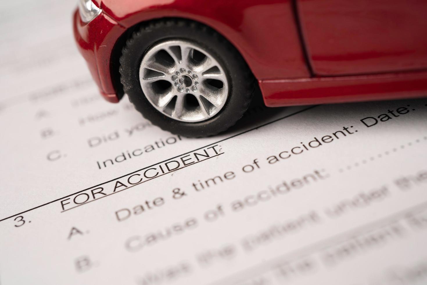 Stethoscope on Insurance claim accident car form, Car loan photo