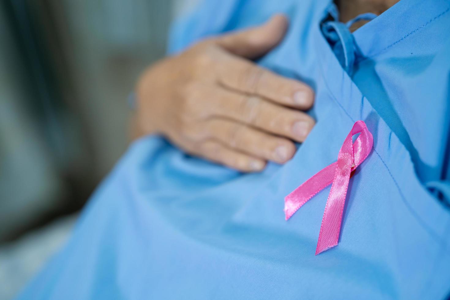 Breast cancer, pink ribbon at Asian senior lady patient photo