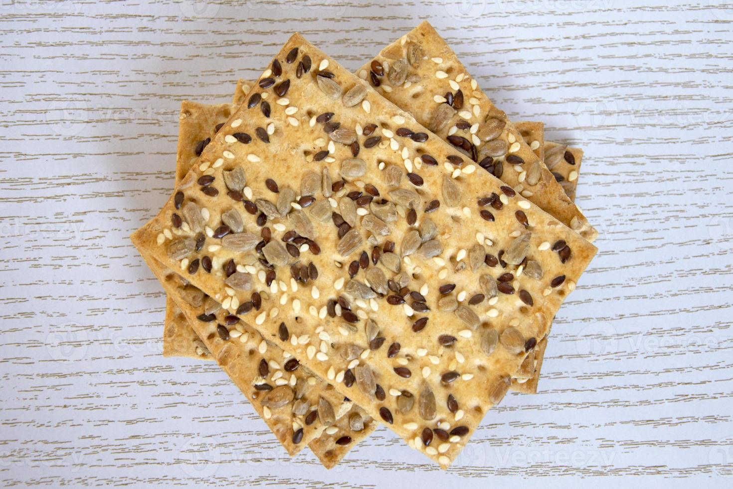 Cookies with sunflower seeds on a wooden background, top view photo