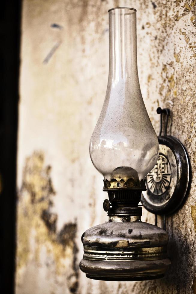 Abstract Vintage Oil Lamp on the Wall photo