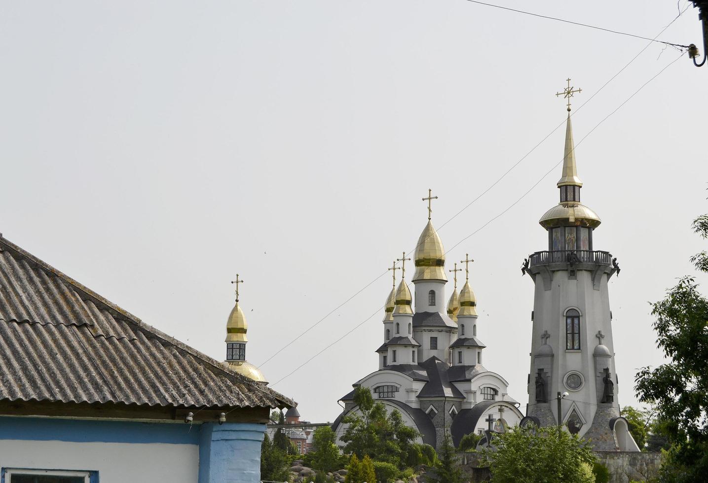 Christian church cross in high steeple tower for prayer photo