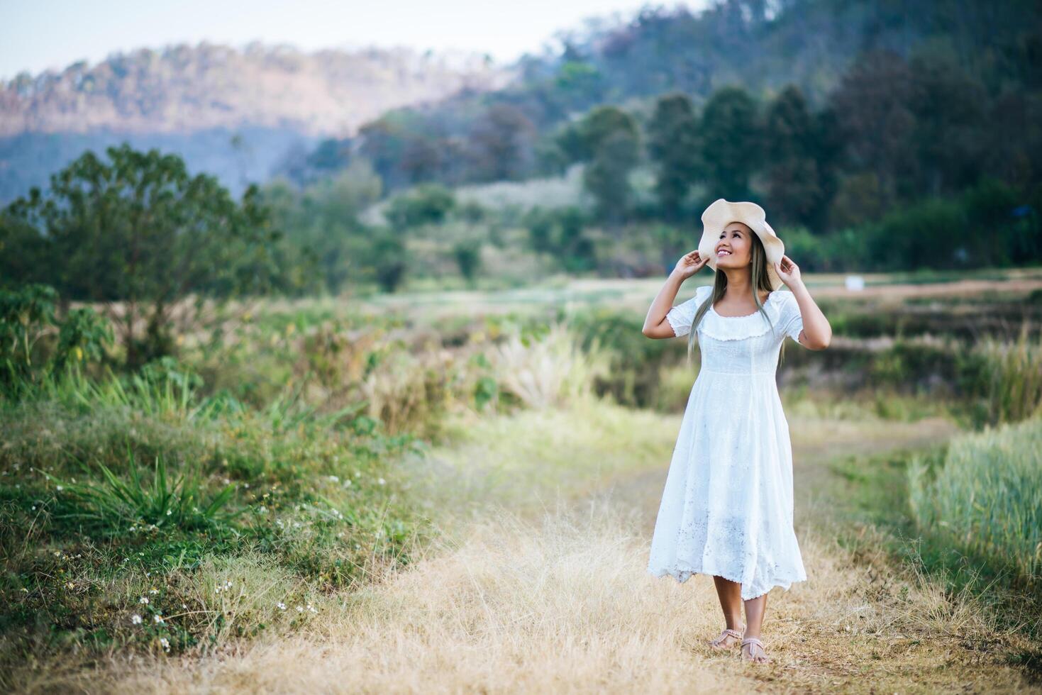 Woman in the hat happiness in the nature photo