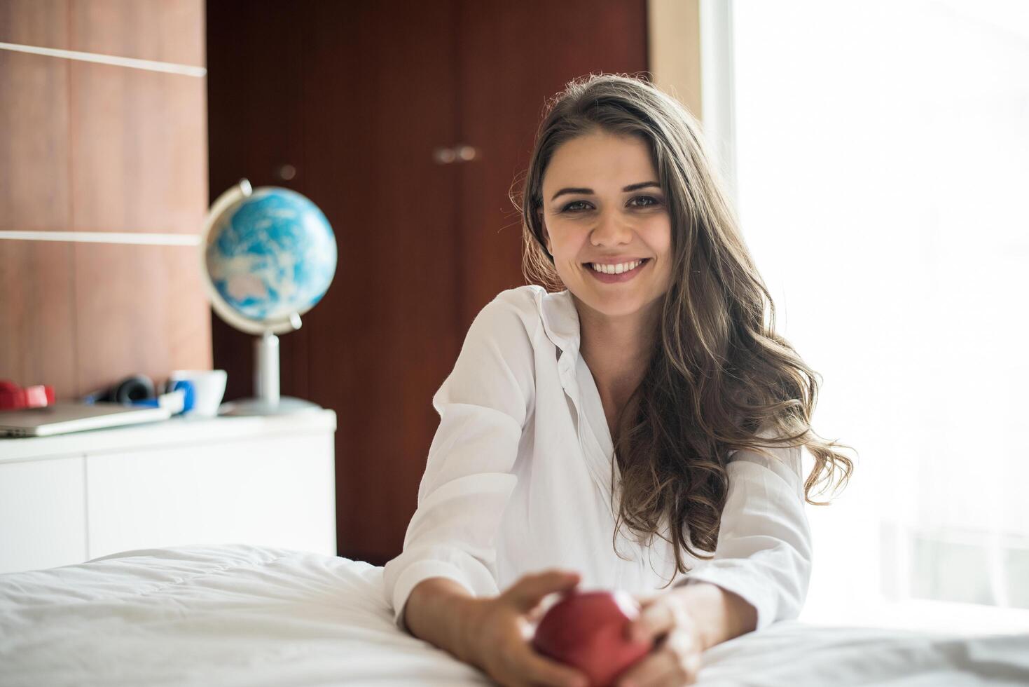 Portrait of woman lying at the bed photo