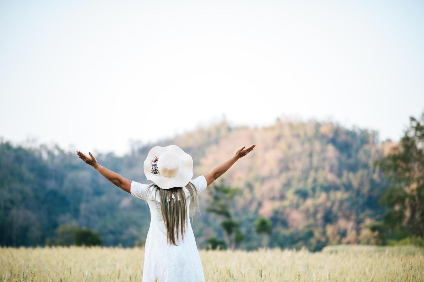 Woman in the hat happiness in the nature photo