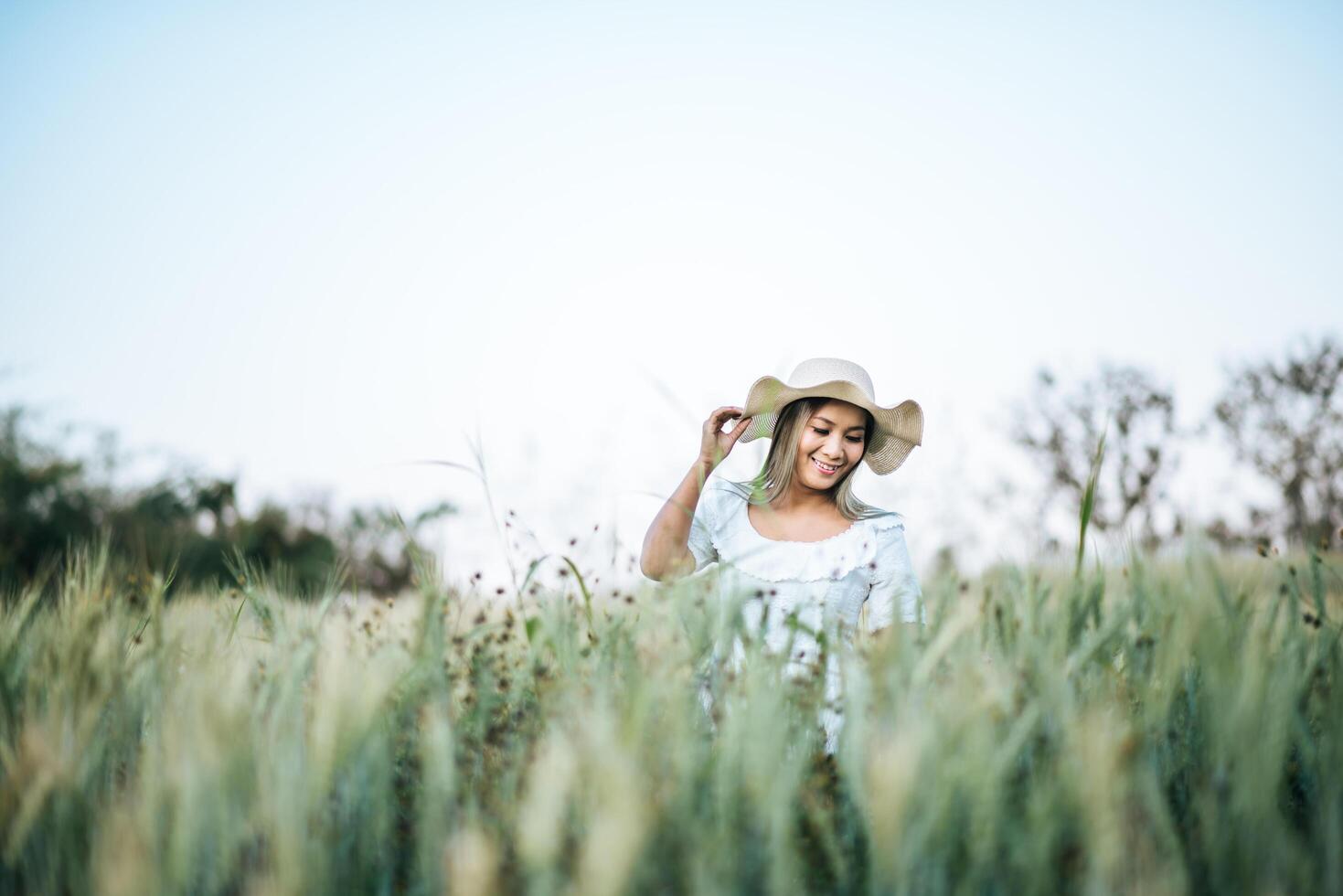 Woman in the hat happiness in the nature photo