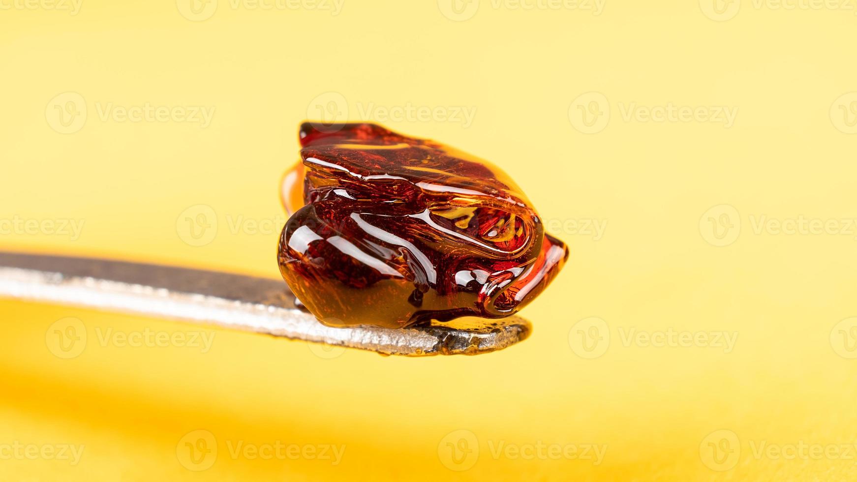 Cannabis wax dab concentrate on a stick for smoking essential oils photo