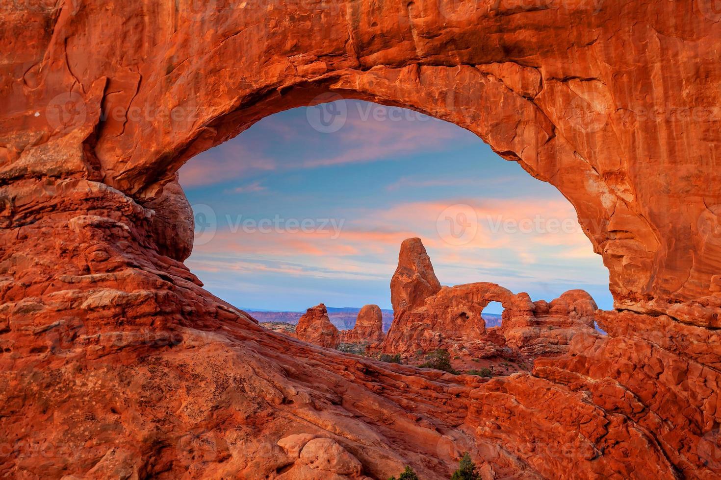 Turret arch through the North Window in Arches National Park in Utah photo