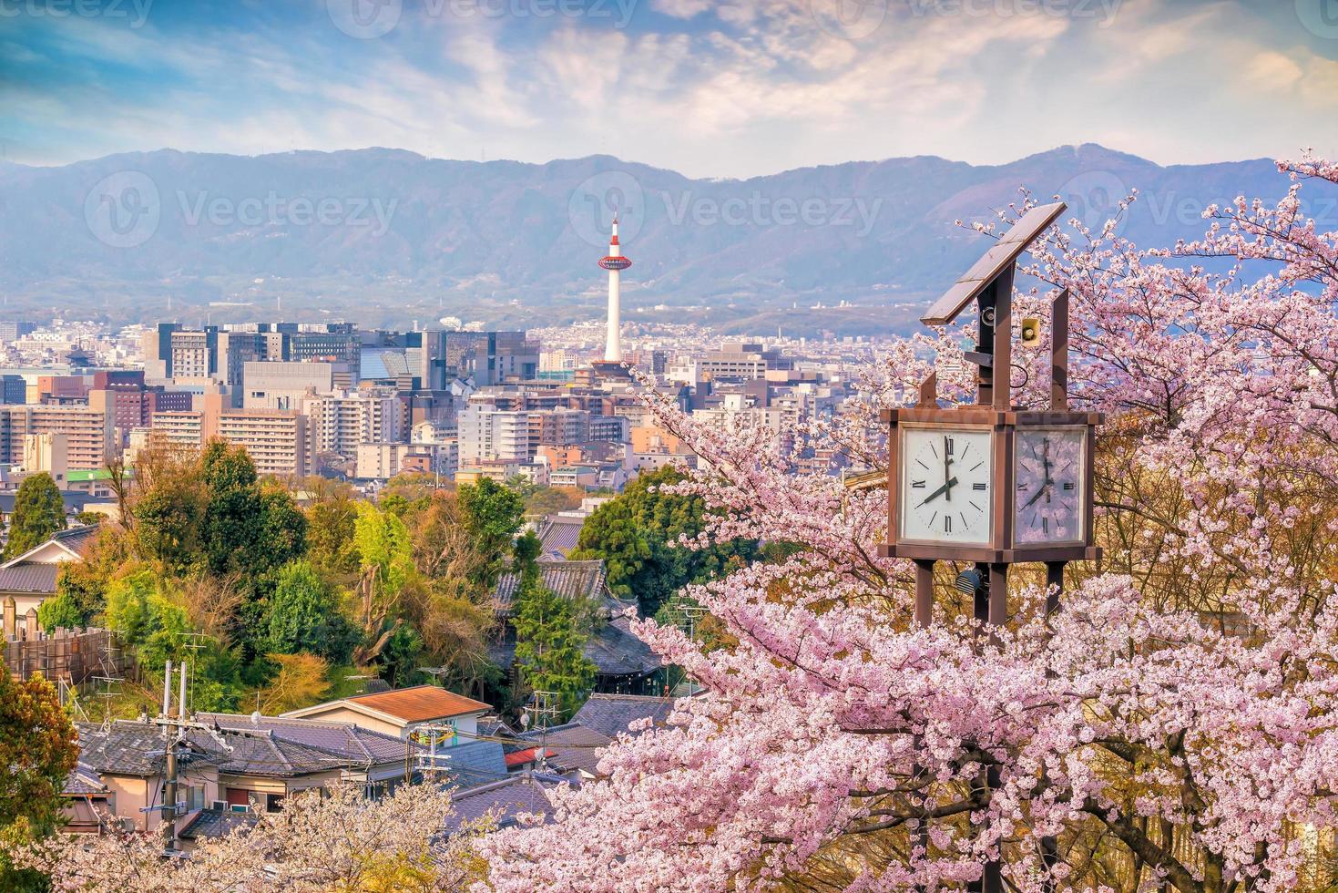 Kyoto city skyline with sakura photo