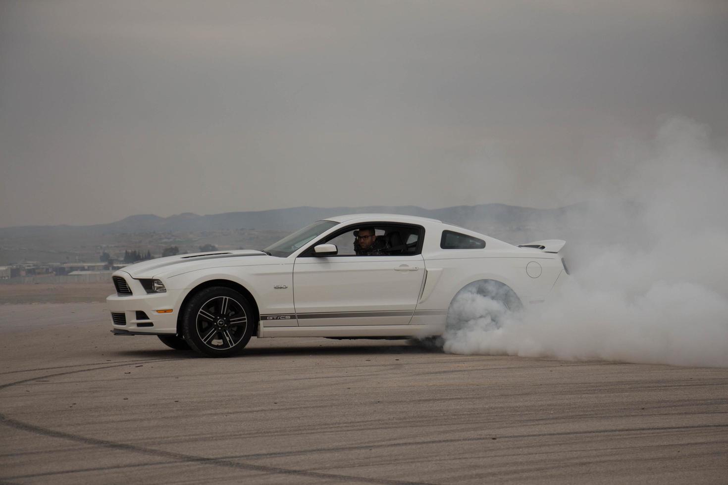 Cars on the race track and on the roads of the desert photo