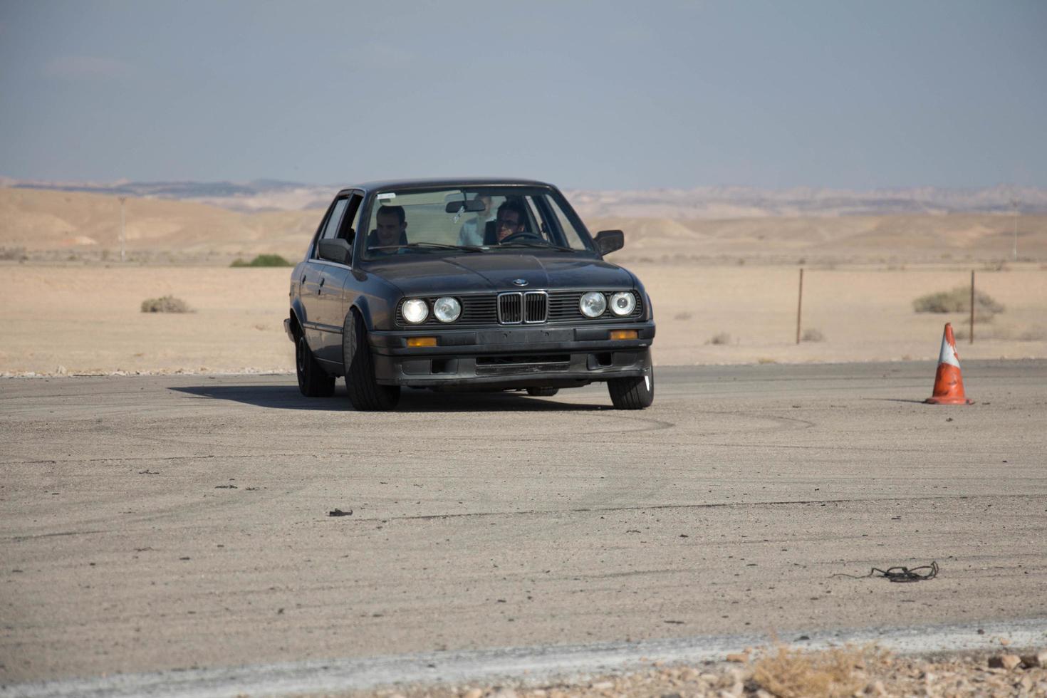 Cars on the race track and on the roads of the desert photo