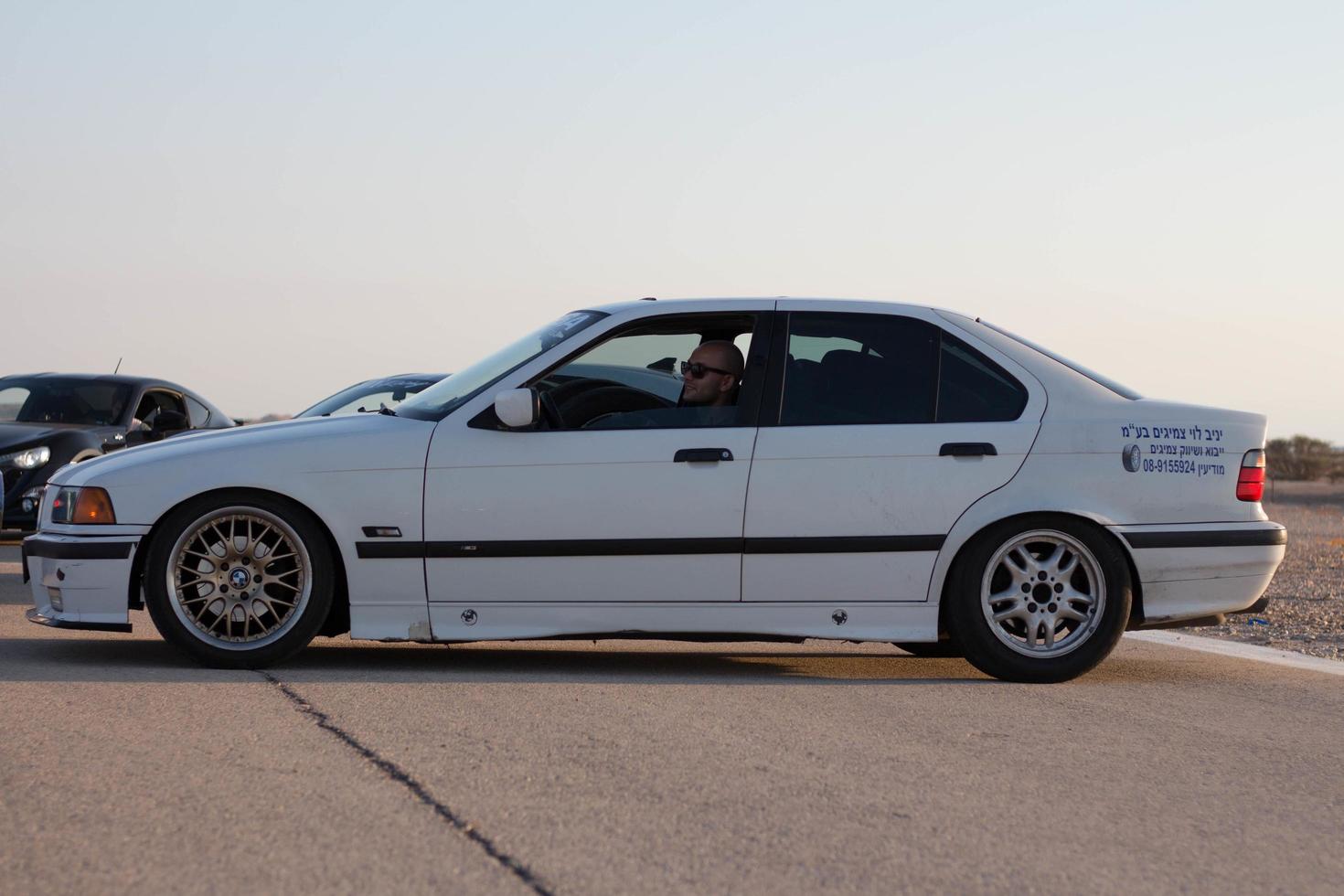 Cars on the race track and on the roads of the desert photo