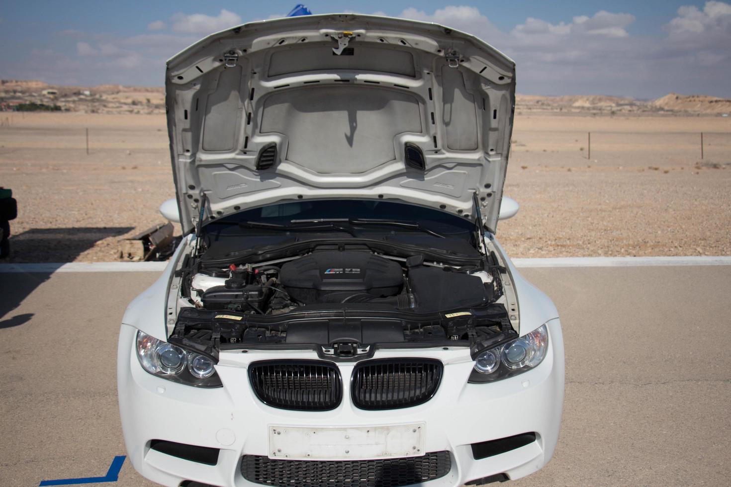 Cars on the race track and on the roads of the desert photo
