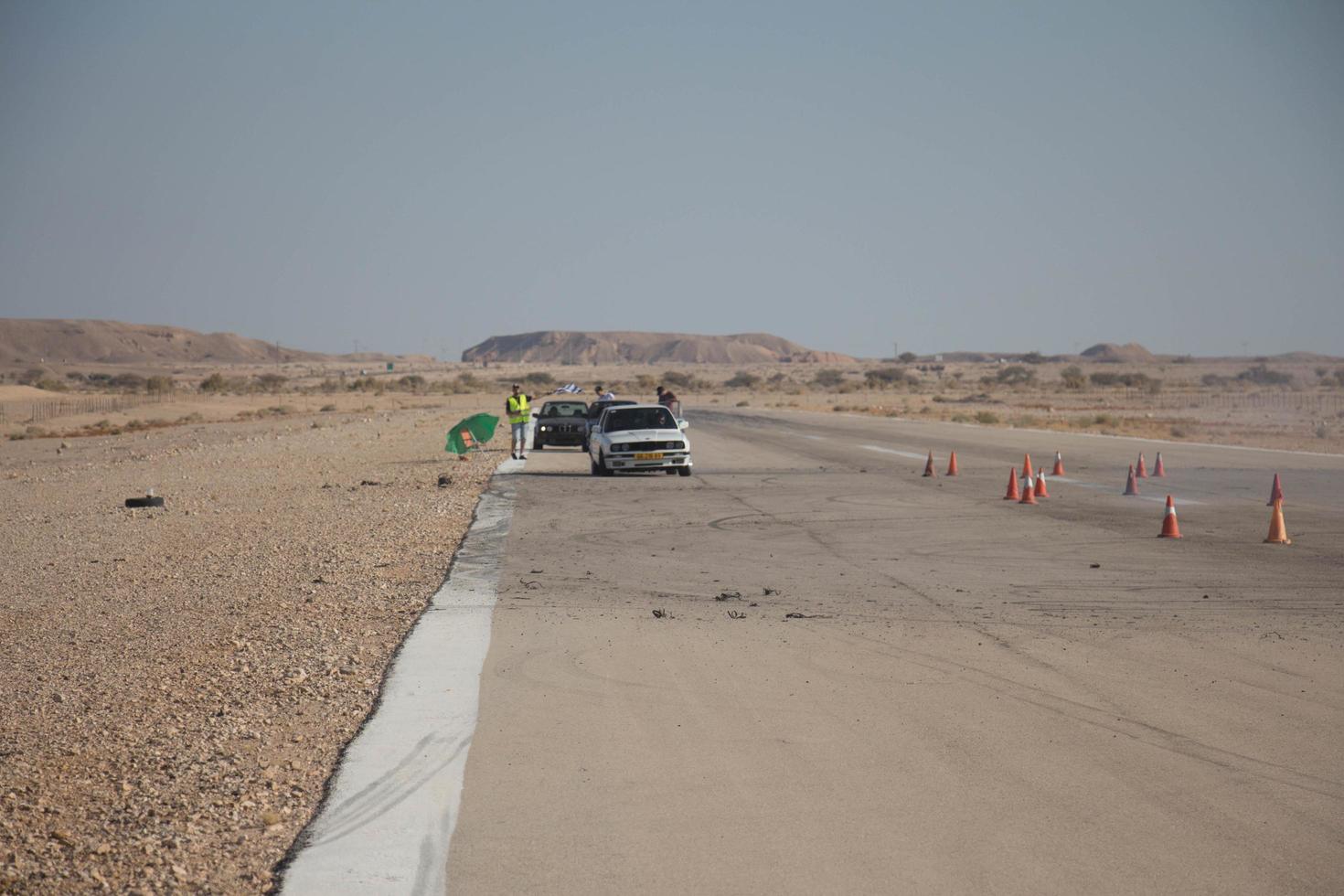Cars on the race track and on the roads of the desert photo
