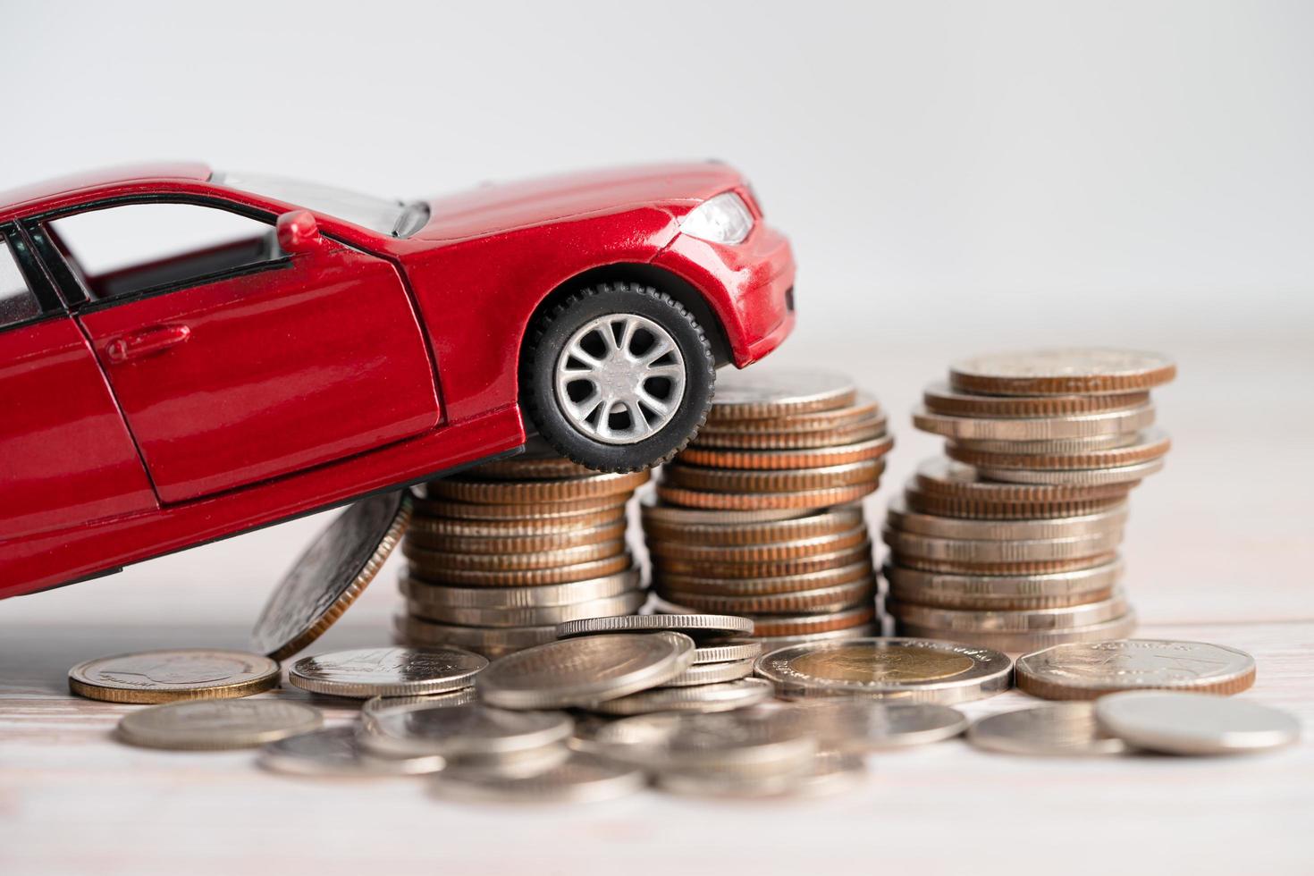 Car on stack of coins. Car loan, Finance, saving money photo