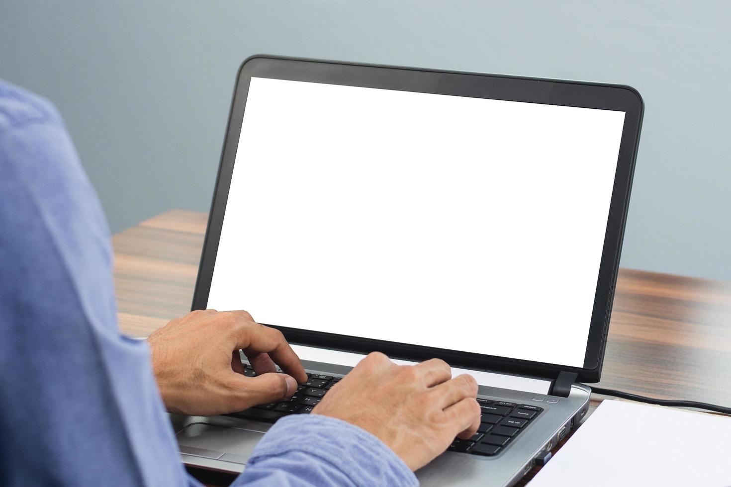 Man using computer screen mockup in office photo