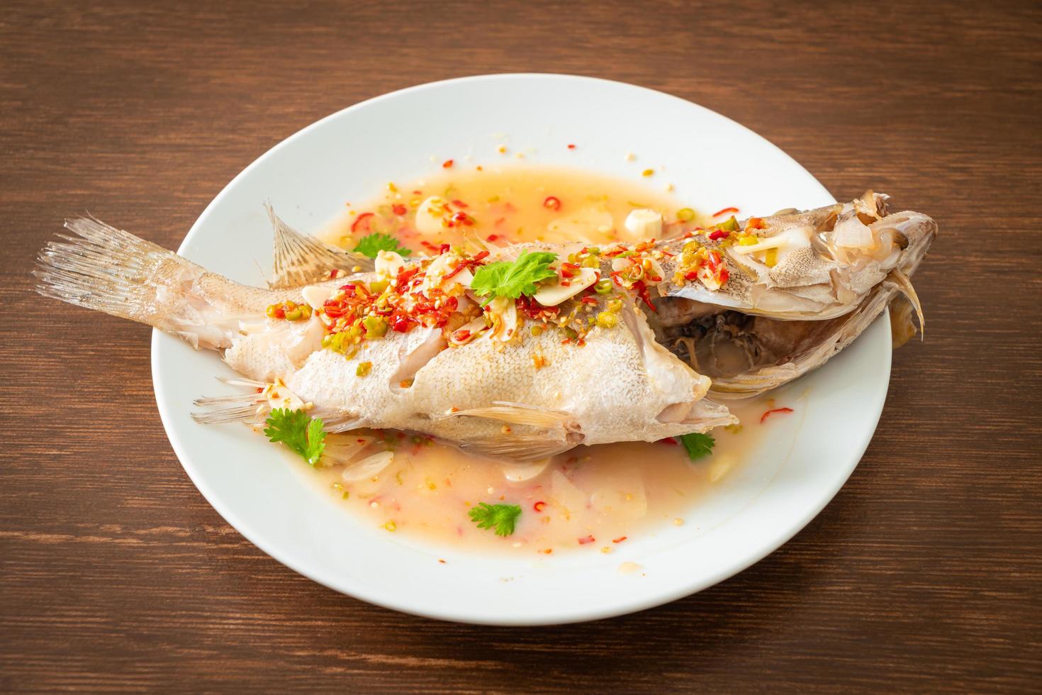 Steamed grouper fish with lime and chillies photo